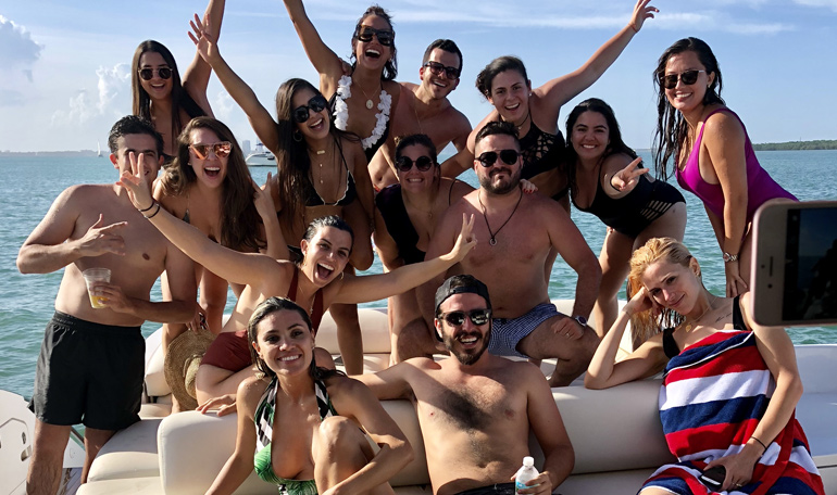 A group poses for a picture on the Black Ice yacht.